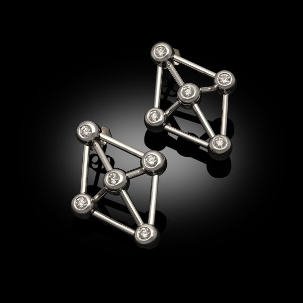 A striking pair of geometric diamond-set Covalent earrings in 18ct white gold.