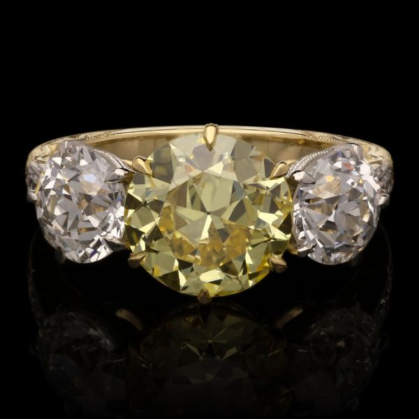 2.41ct Fancy Intense Yellow Diamond Ring with Old European Cut Diamond Shoulders.
