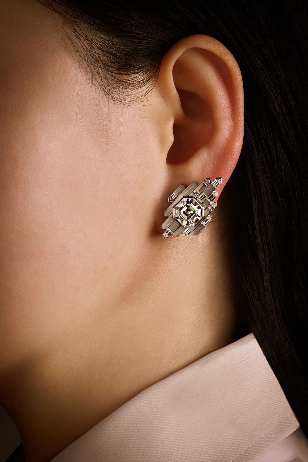 The Asscher cut diamond earring, worn