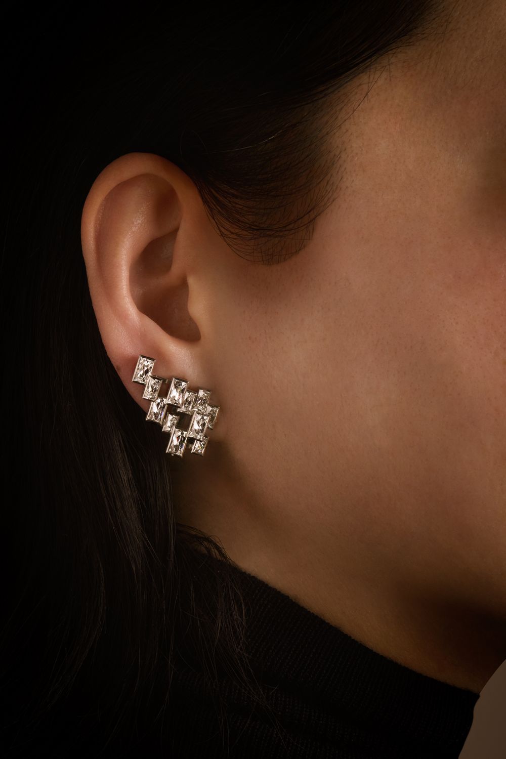 The earrings worn without their drops